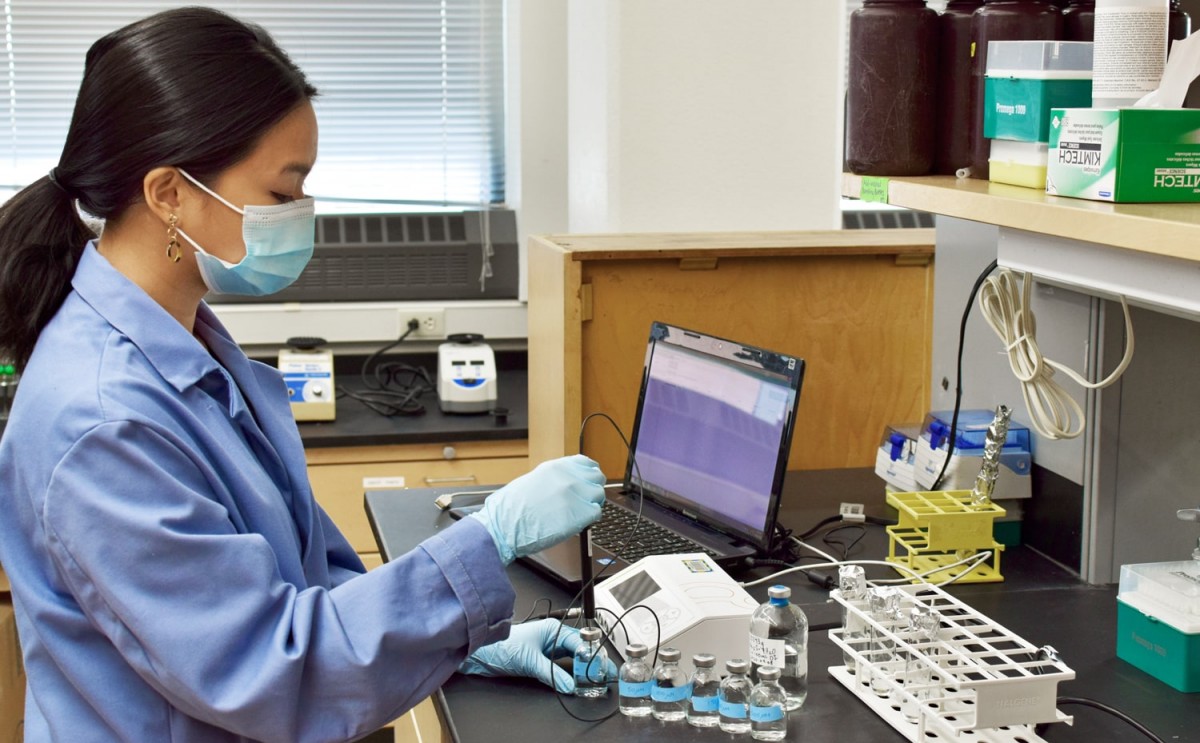 Graduate student Patricia Tran measures sulfide for her experiment.