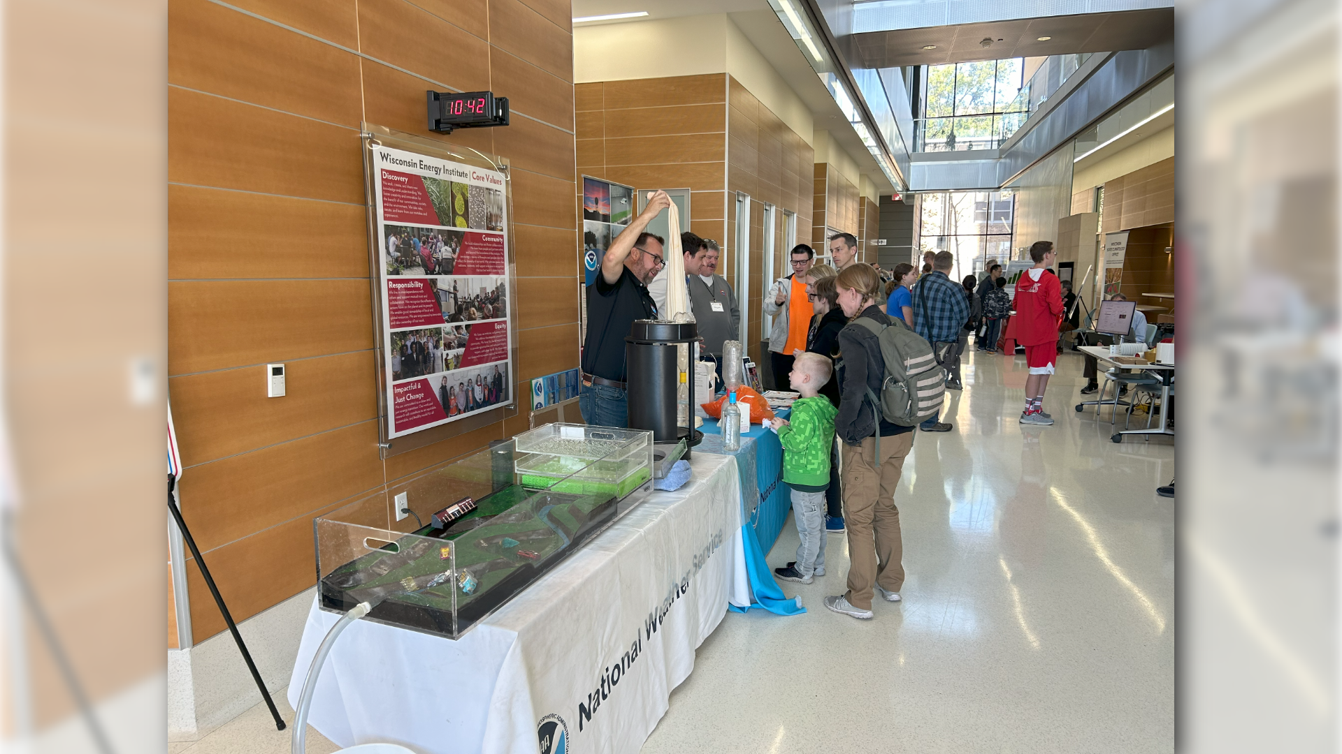 A family interacts with weather activity during the first annual WI Weather Fest
