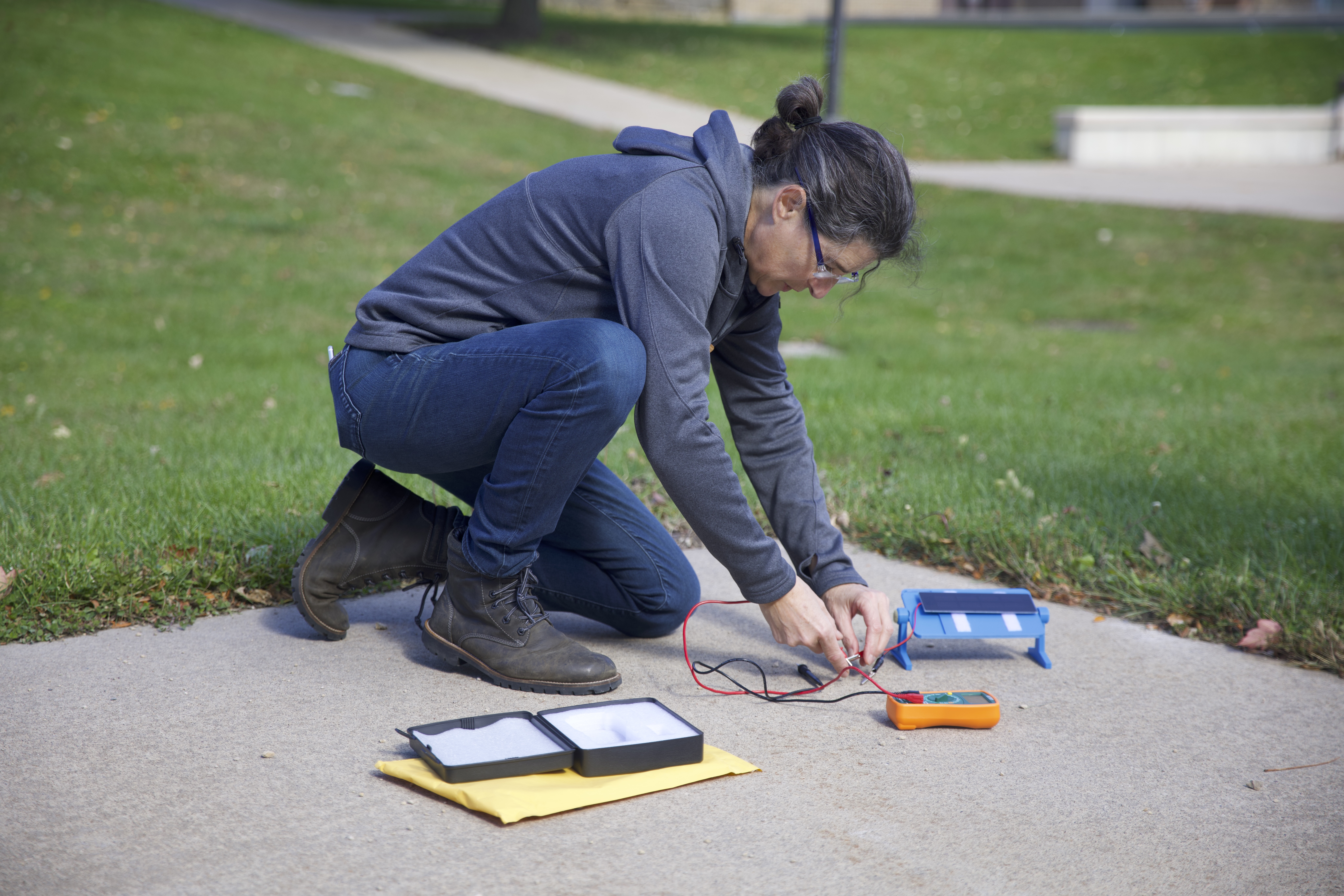 A teacher uses a solar panel and multimeter