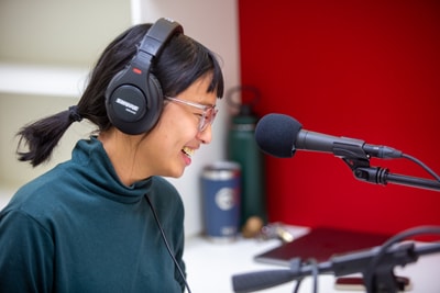 Michelle Chung laughing a podcast recording