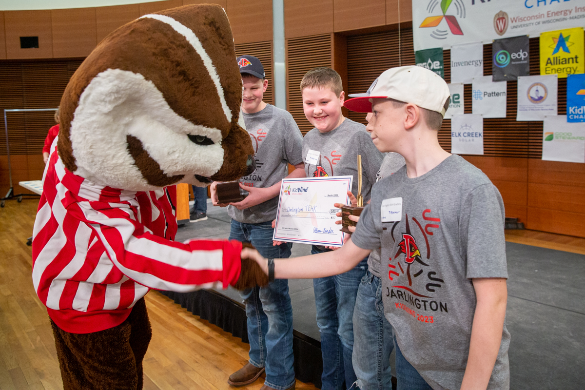 Bucky Badger shakes the hands of a winning team.