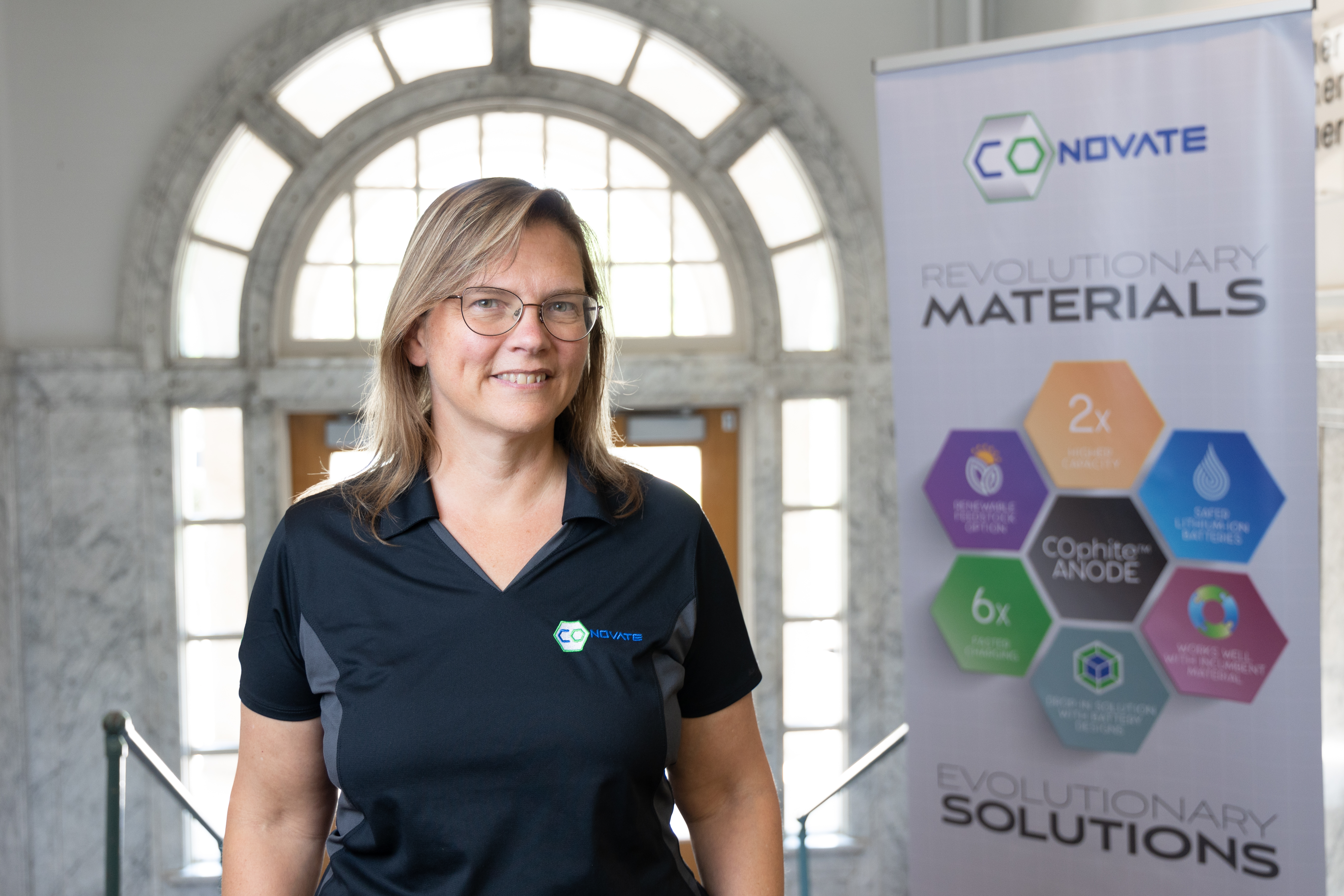 Picture of Carol Hirschmugl standing next to COnovate sign