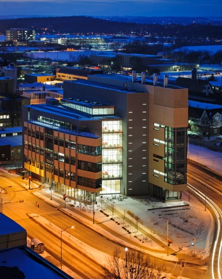 The Wisconsin Energy Institute and snow-covered, central University of Wisconsin-Madison campus are pictured as dusk falls to nighttime during winter on Feb. 11, 2014.