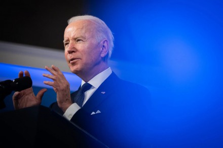 Joe Biden stands at a lecturn