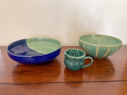 Blue and green pottery as bowls and a mug