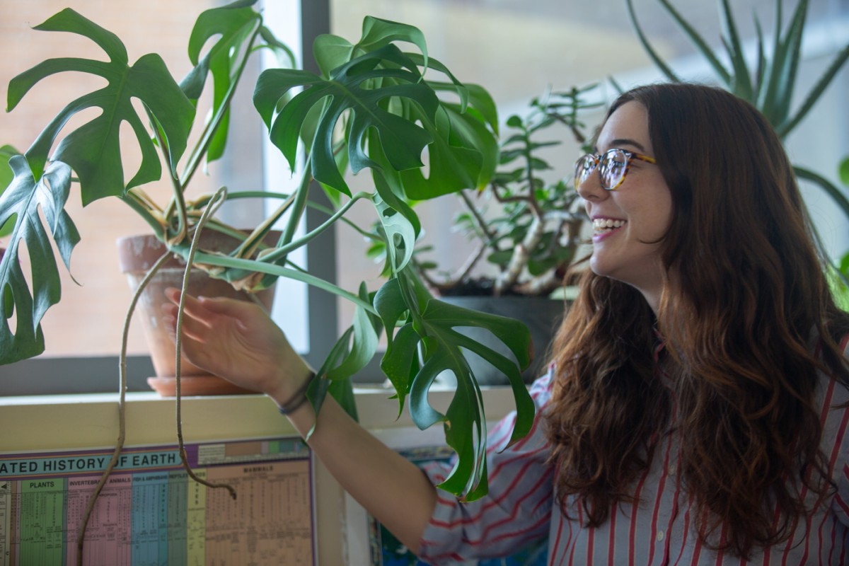 Woman looking at potted plants