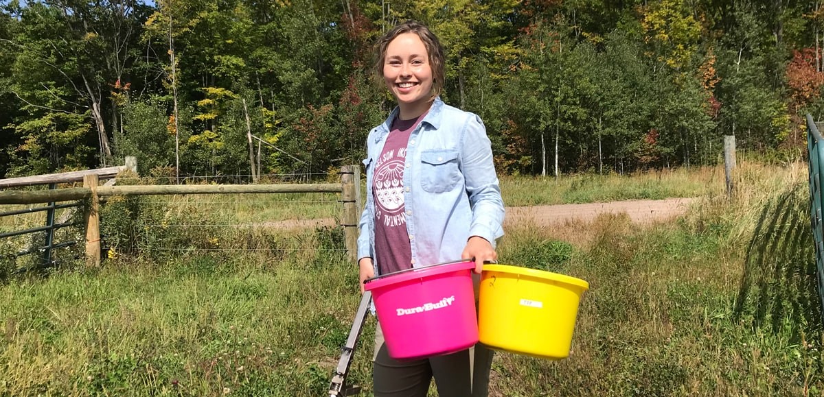 Ashley Becker standing in a field