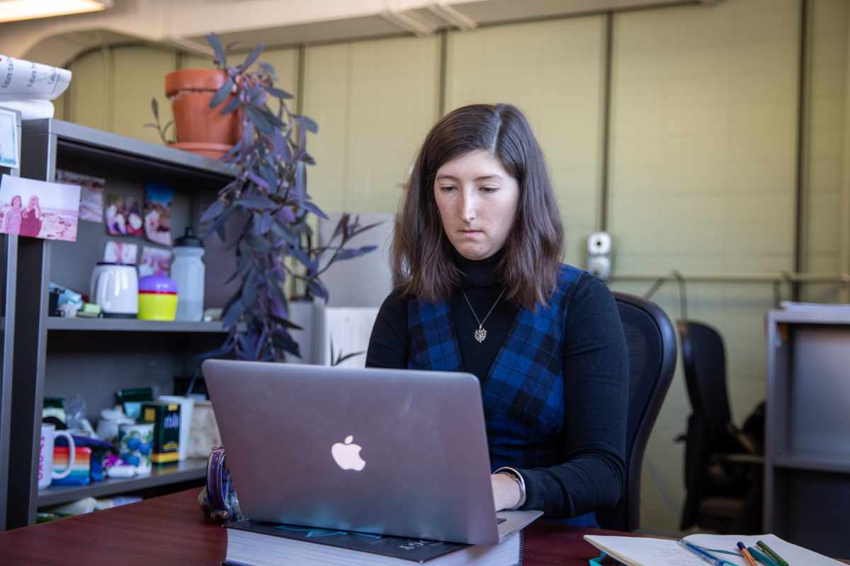 Ciaran Gallagher working at her desk.