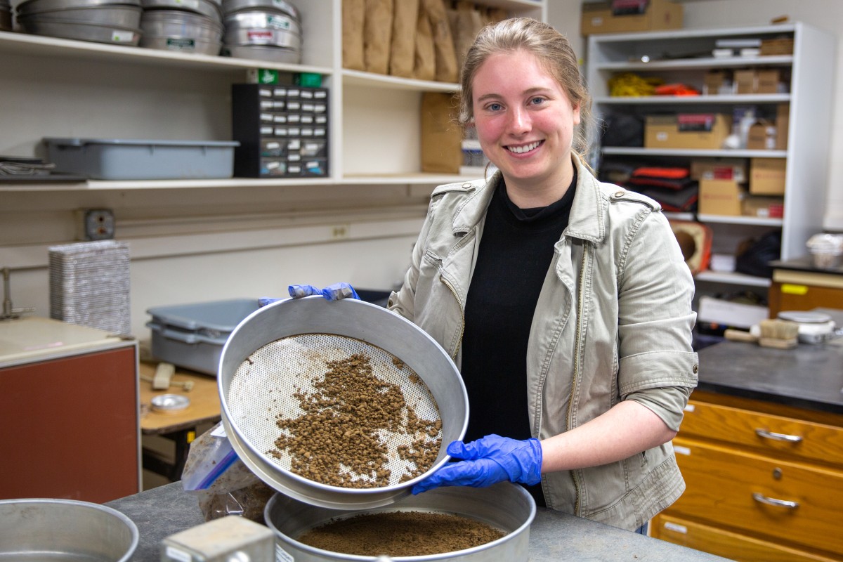 Clare Dietz hold plan with soil.