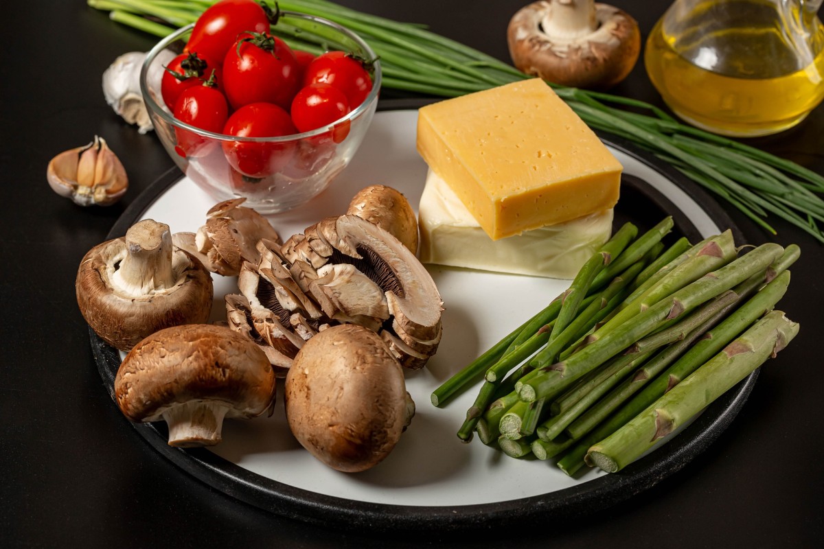 A plate with vegetables and cheese