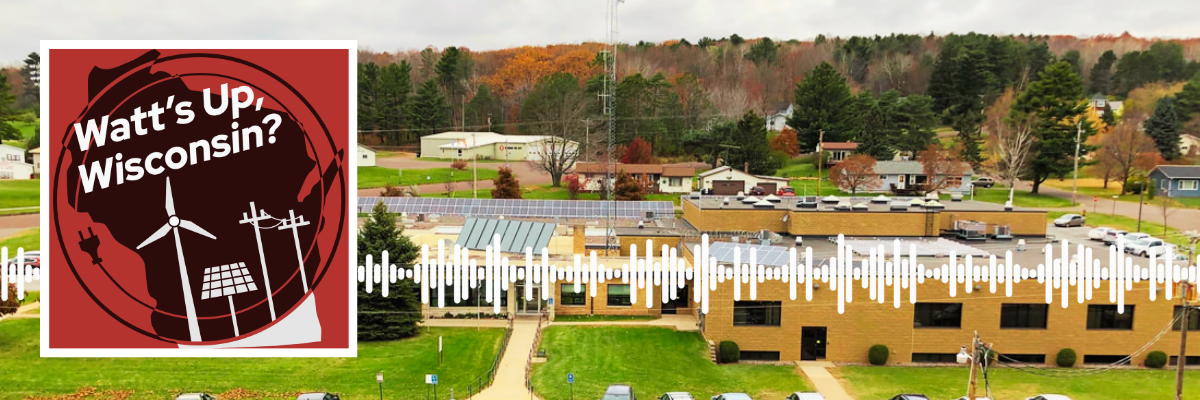 Watt's Up Wisconsin Logo with a photo of Bayfield County's municipal building with solar on the roof.