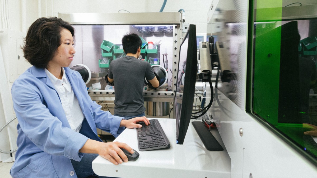 Yafei Wang, a scientist in Couet’s research group and first author on the paper, sits in front of a computer.