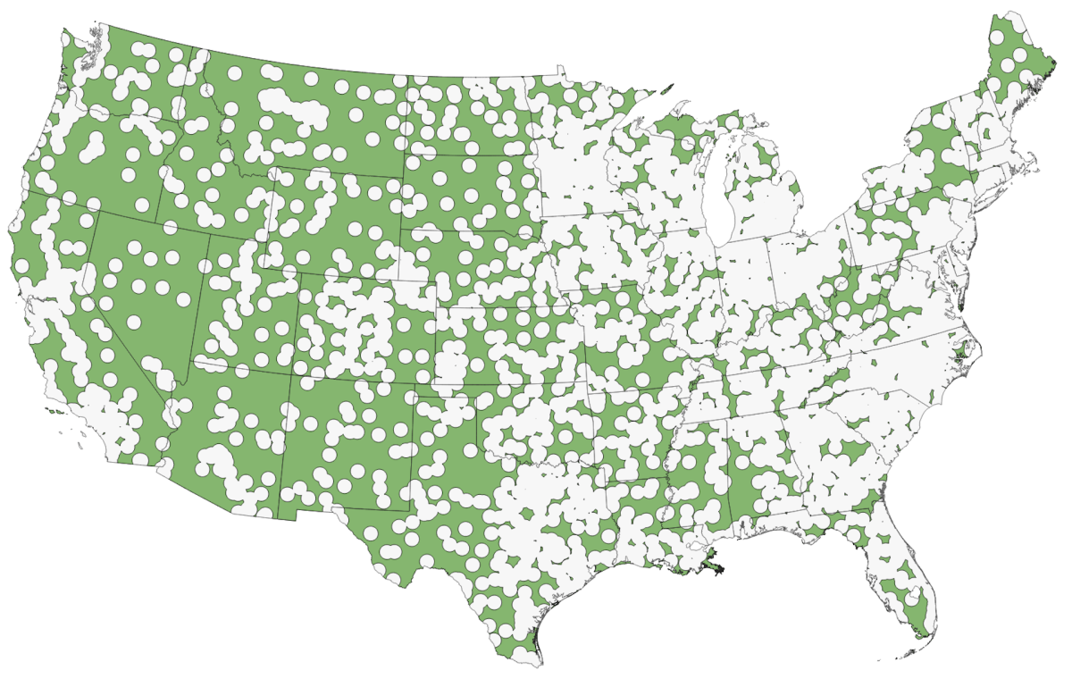 Map of the contiguous United States showing the distribution and coverage area of a dense weather station network, with white dots representing individual stations and green shading indicating spatial coverage, distributed broadly across the country with some gaps in the Upper Midwest and parts of the East.
