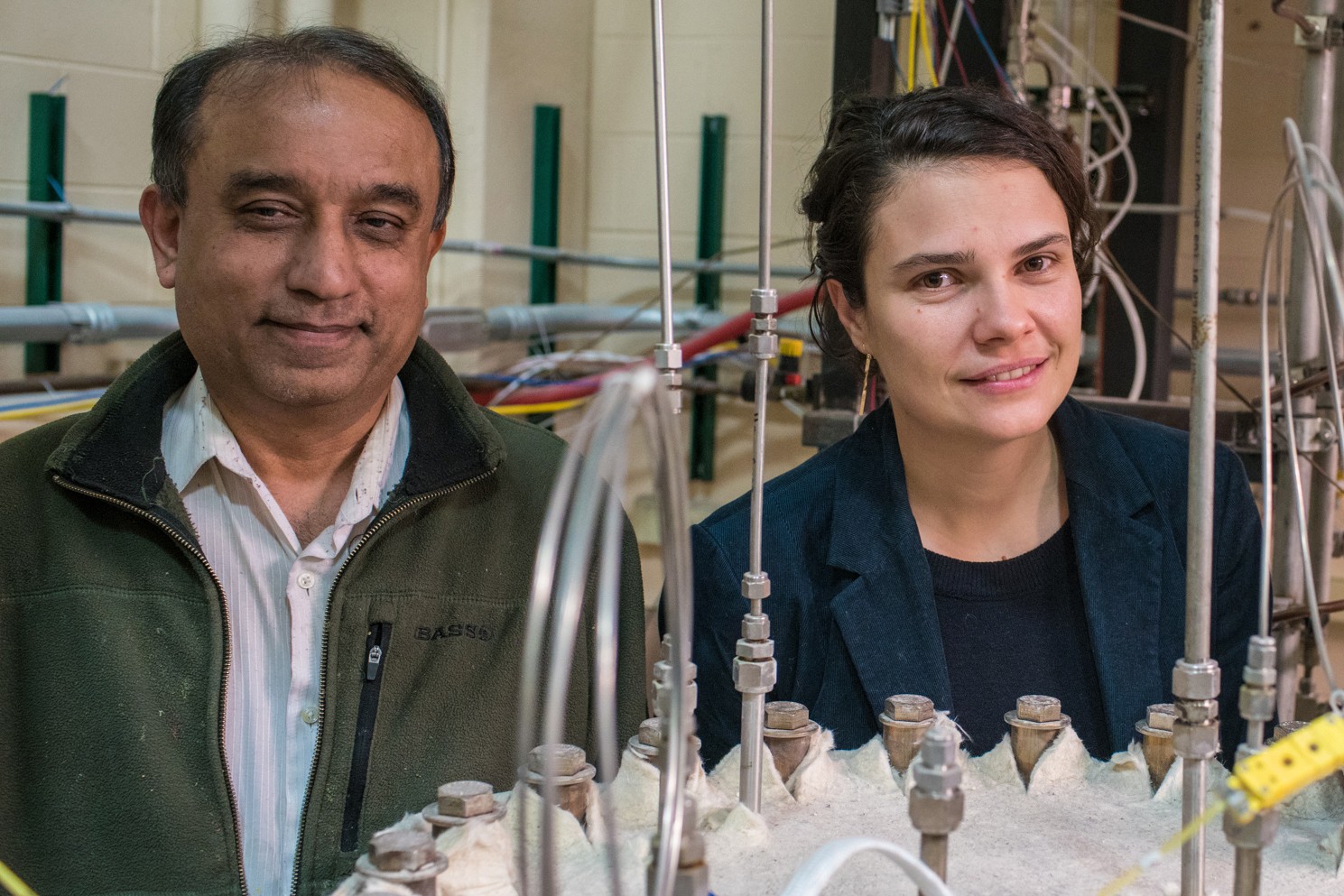 Distinguished Research Professor Kumar Sridharan (left) will develop a low temperature powder spray deposition process for the manufacture of fuel cladding of oxide dispersion strengthened steels. Assistant Professor of Engineering Physics Raluca Scarlat (right) will investigate radiation heat transport in molten salts, and seek to add functionality for radiative heat transport in a thermal-hydraulics system code. Photo by Gregory Vershbow