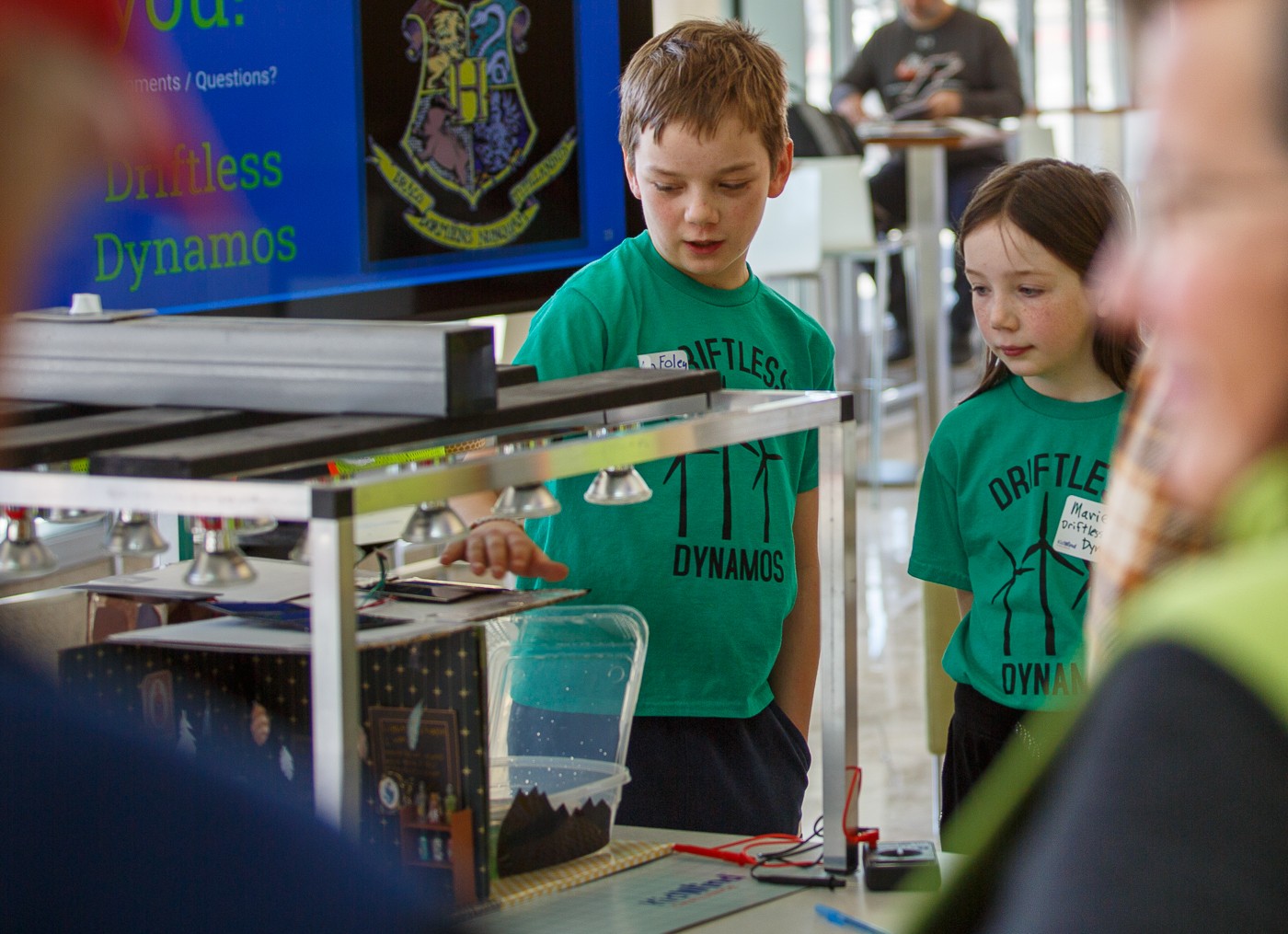 Nolan and Mariel Foley present their solar-powered model of Hogwarts to judges