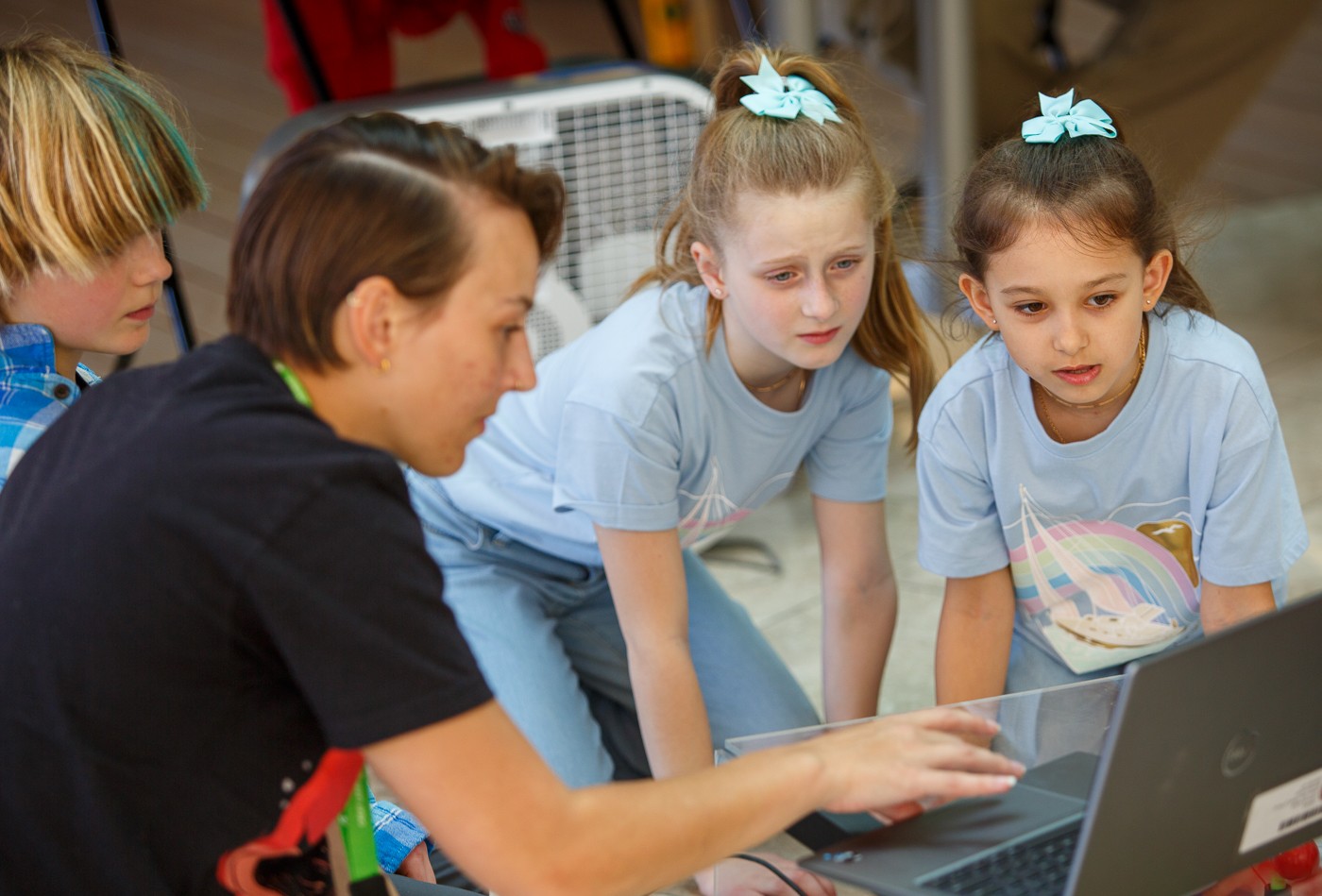 From left, Rayn Rossmiller, Mila Rosengren, and Sawyer White from Sugar Maple Nature School participate in an instant challenge