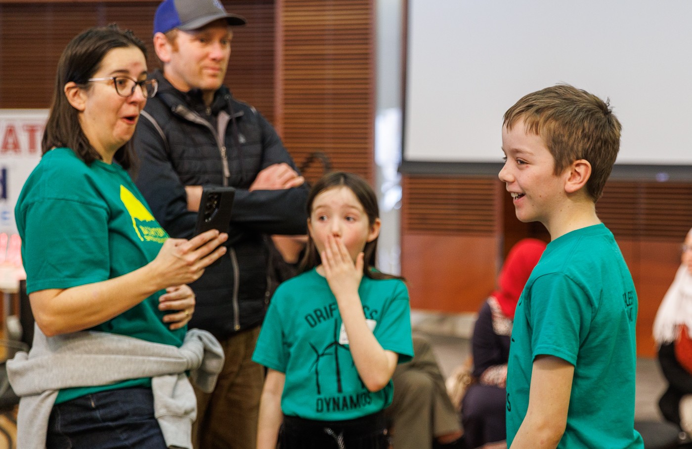 From left, Karolanne Foley, Mariel Foley, and Nolan Foley of the Mormon Coulee 4H Club in Stoddard react to their wind turbine performance