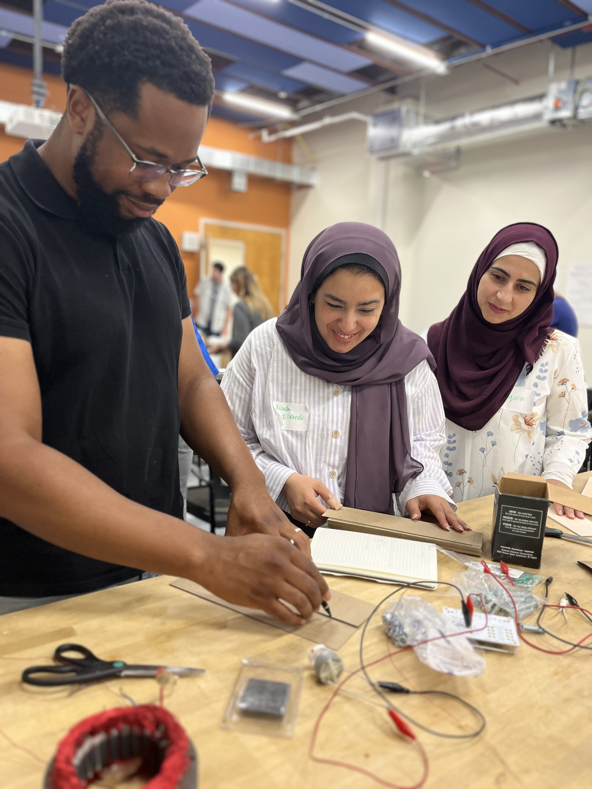Teachers work with electricity at a previous KidWind workshop