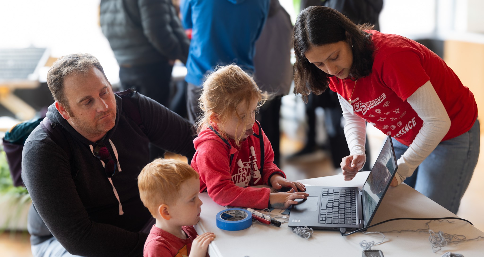A student prepares to run a wind farm simulation test during science expeditions.