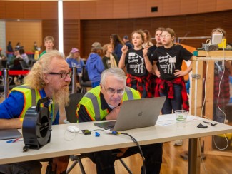 Students and judges watch energy output of turbine