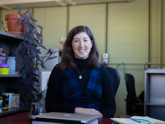 Ciaran Gallagher at her desk.