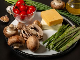 A plate with vegetables and cheese