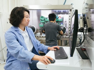 Yafei Wang, a scientist in Couet’s research group and first author on the paper, sits in front of a computer.