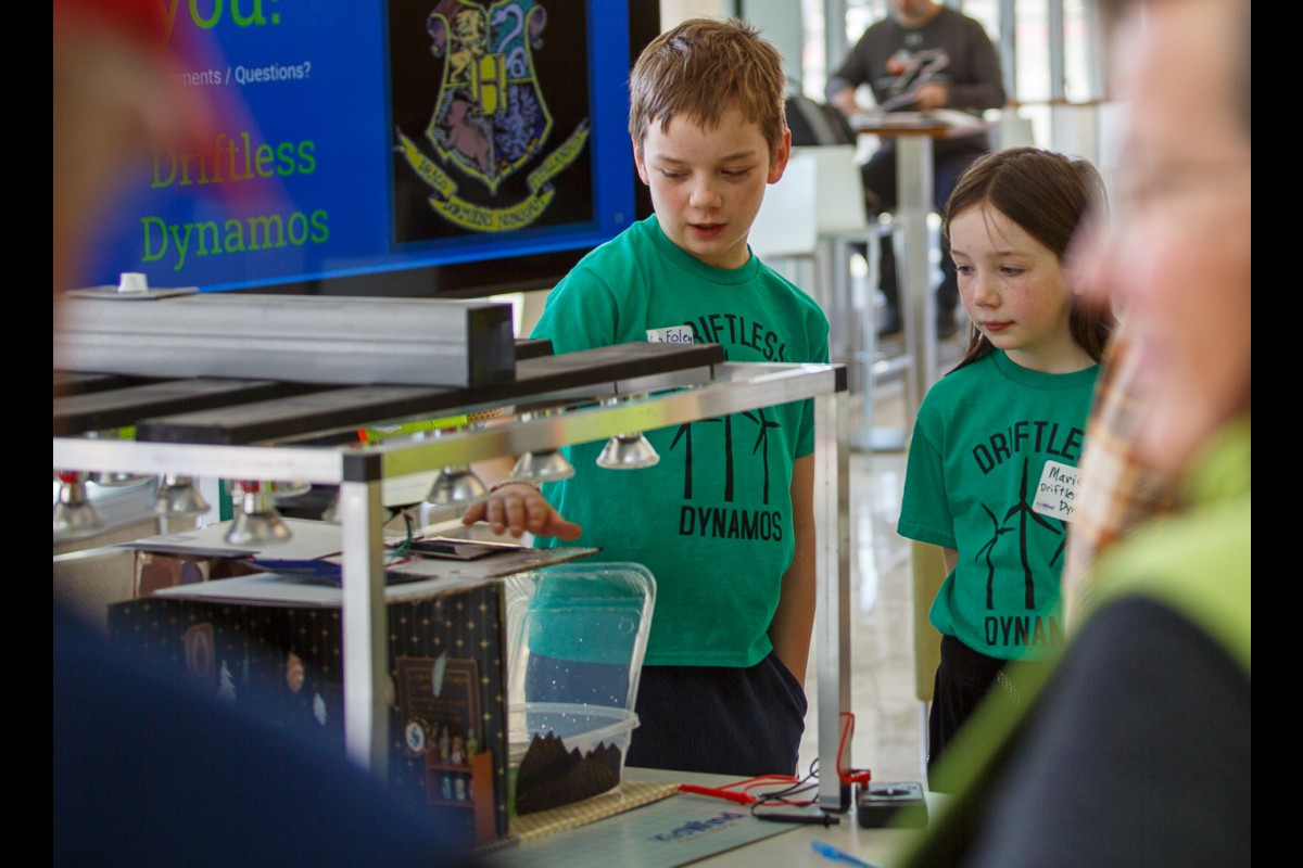 Nolan and Mariel Foley present their solar-powered model of Hogwarts to judges