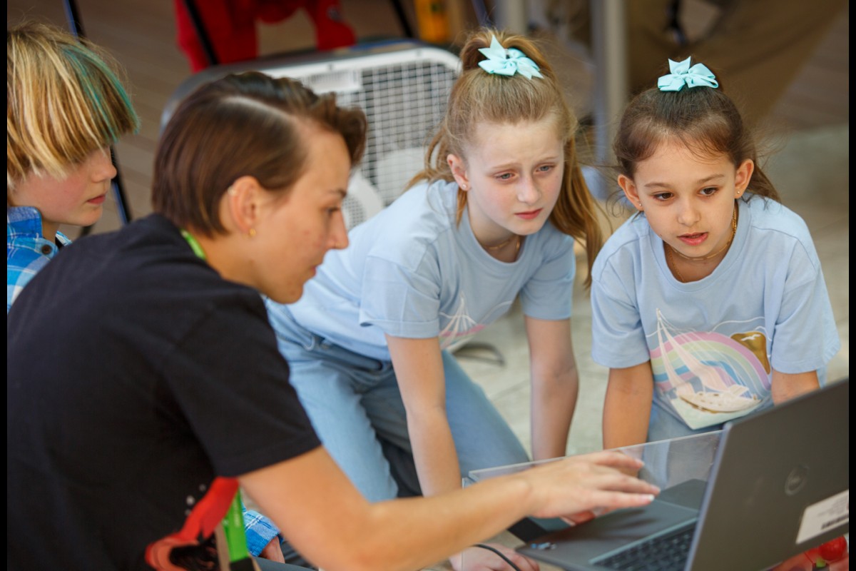 From left, Rayn Rossmiller, Mila Rosengren, and Sawyer White from Sugar Maple Nature School participate in an instant challenge