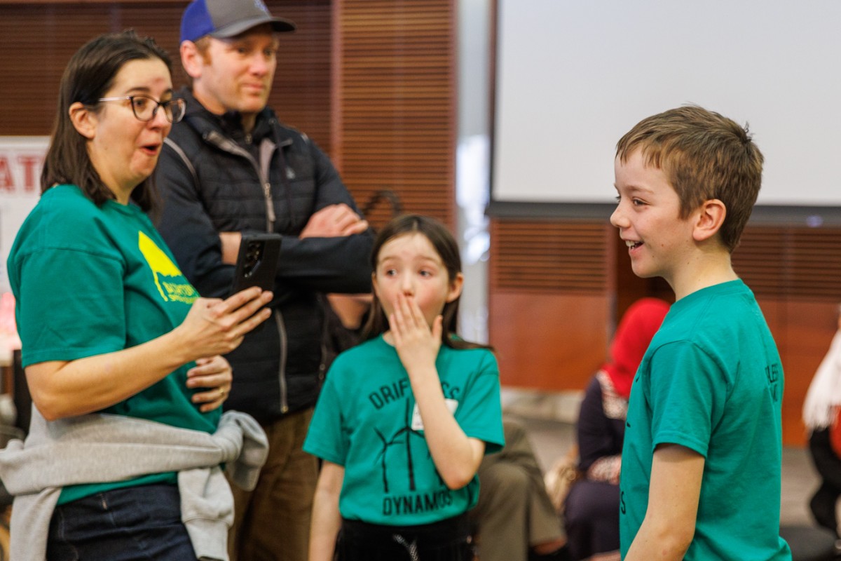 From left, Karolanne Foley, Mariel Foley, and Nolan Foley of the Mormon Coulee 4H Club in Stoddard react to their wind turbine performance