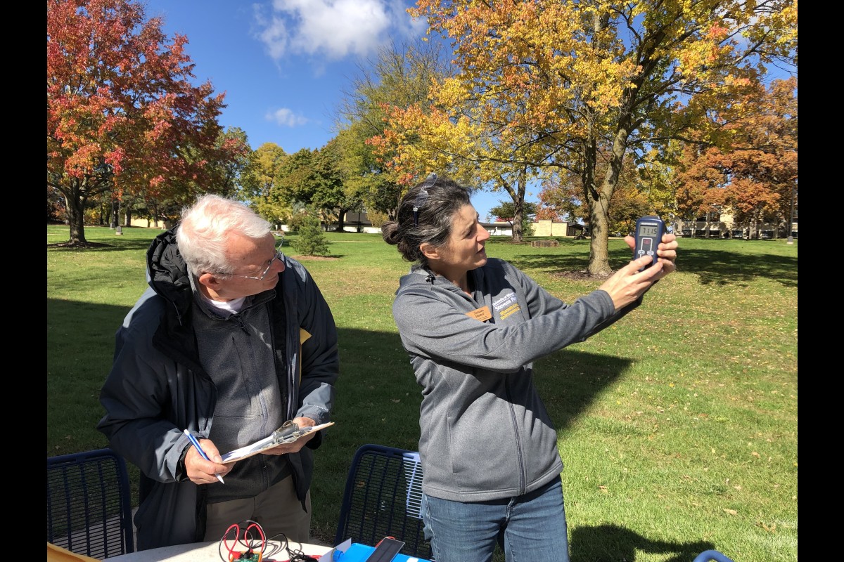 Educators at a previous workshop work together to measure the sun's radiance in a lesson on solar power.
