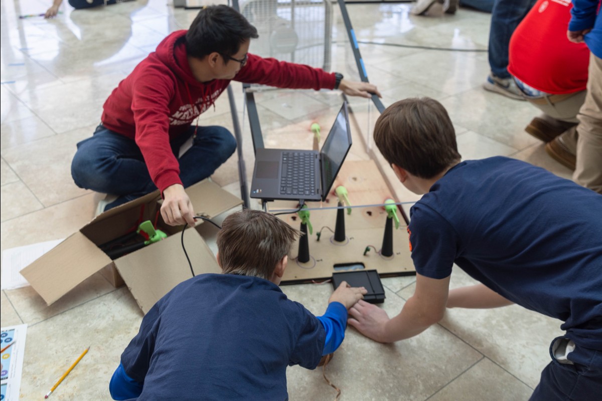Students work on one of the 2025 "Instant Challenge" activities and design a wind farm to minimize the wake effect.