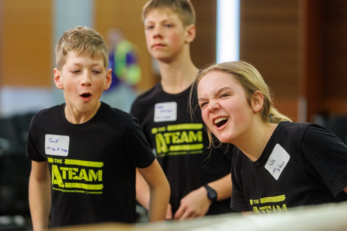 Members of the St. Matthews Lutheran School A-Team, from Stoddard, Wis., react to the results of their wind turbine test results.