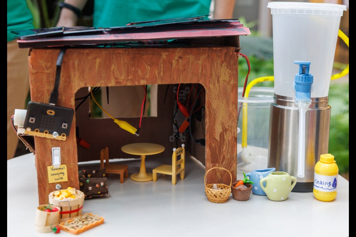 A model solar home built by the Driftless Dynamos from Stoddard, Wis., sits on display. The team placed first in the middle school solar competition.