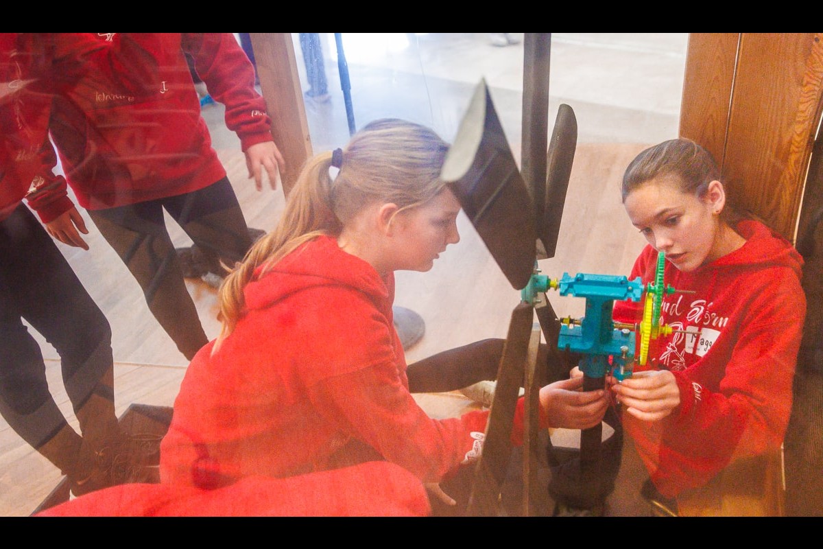 Members of the Darlington Wind Storm team prepare their wind turbine for testing in a wind tunnel. The team placed first in the middle school wind category.