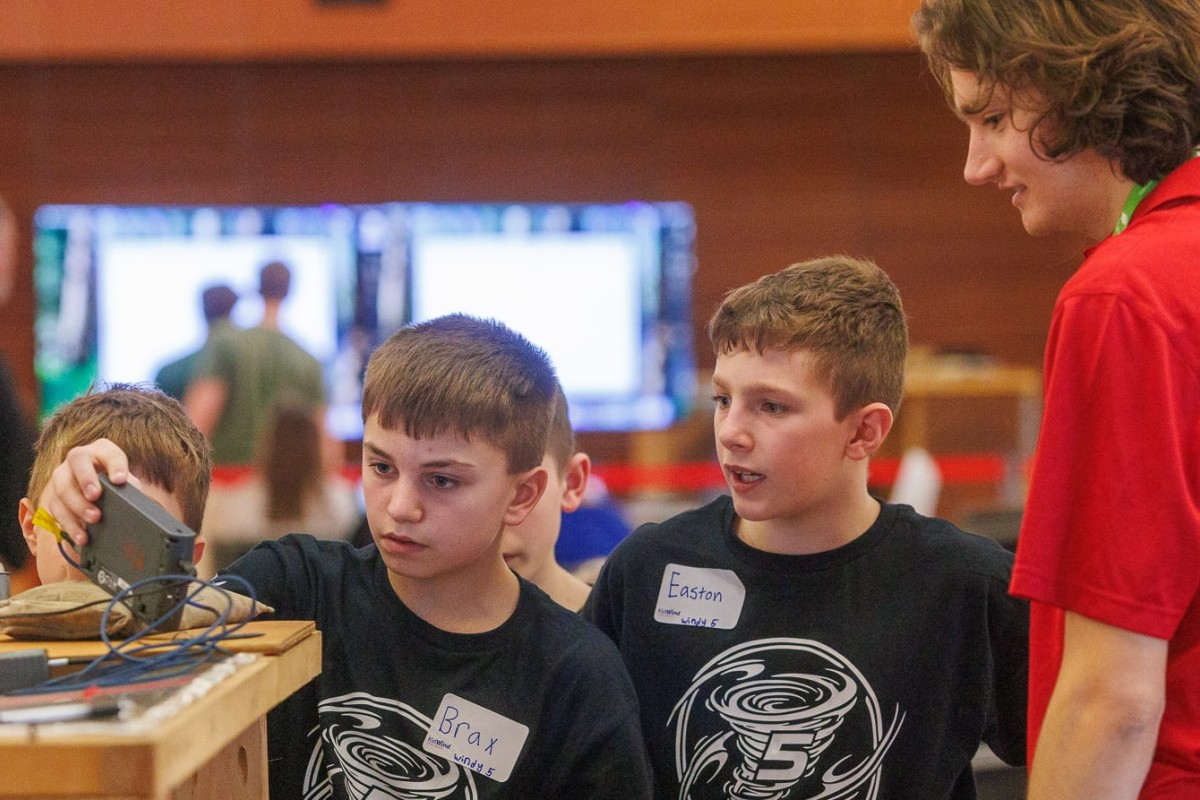 Members of the Darlington Windy 5 team look at the results of their wind turbine test. The team won the Spirit of WI KidWind award.