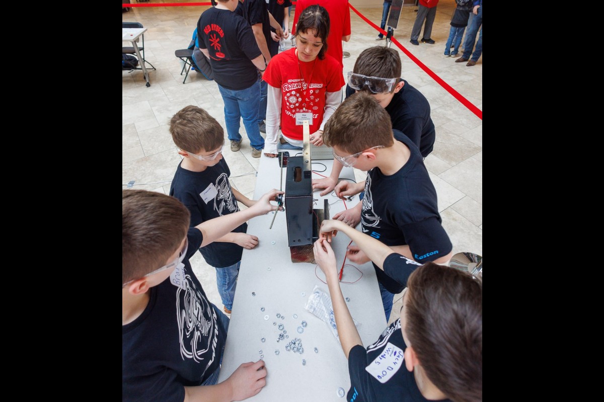 Members of the Darlington Windy 5 team participate in the blade balancing instant challenge. The team won the Spirit of WI KidWind award.